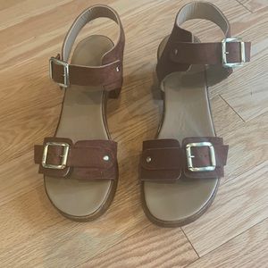 Cute tan suede wooden sandals with gold buckles